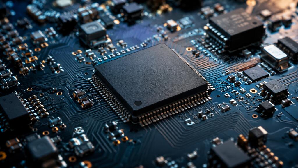Close-up of a microcontroller chip on a circuit board representing ARM Cortex processors for embedded computing.