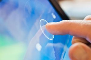 Man touching screen with display